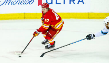 Apr 12, 2026; Calgary, Alberta, CAN; Calgary Flames center Connor Zary (47) controls the puck against the Utah Mammoth during the third period at Scotiabank Saddledome. Mandatory Credit: Sergei Belski-Imagn Images