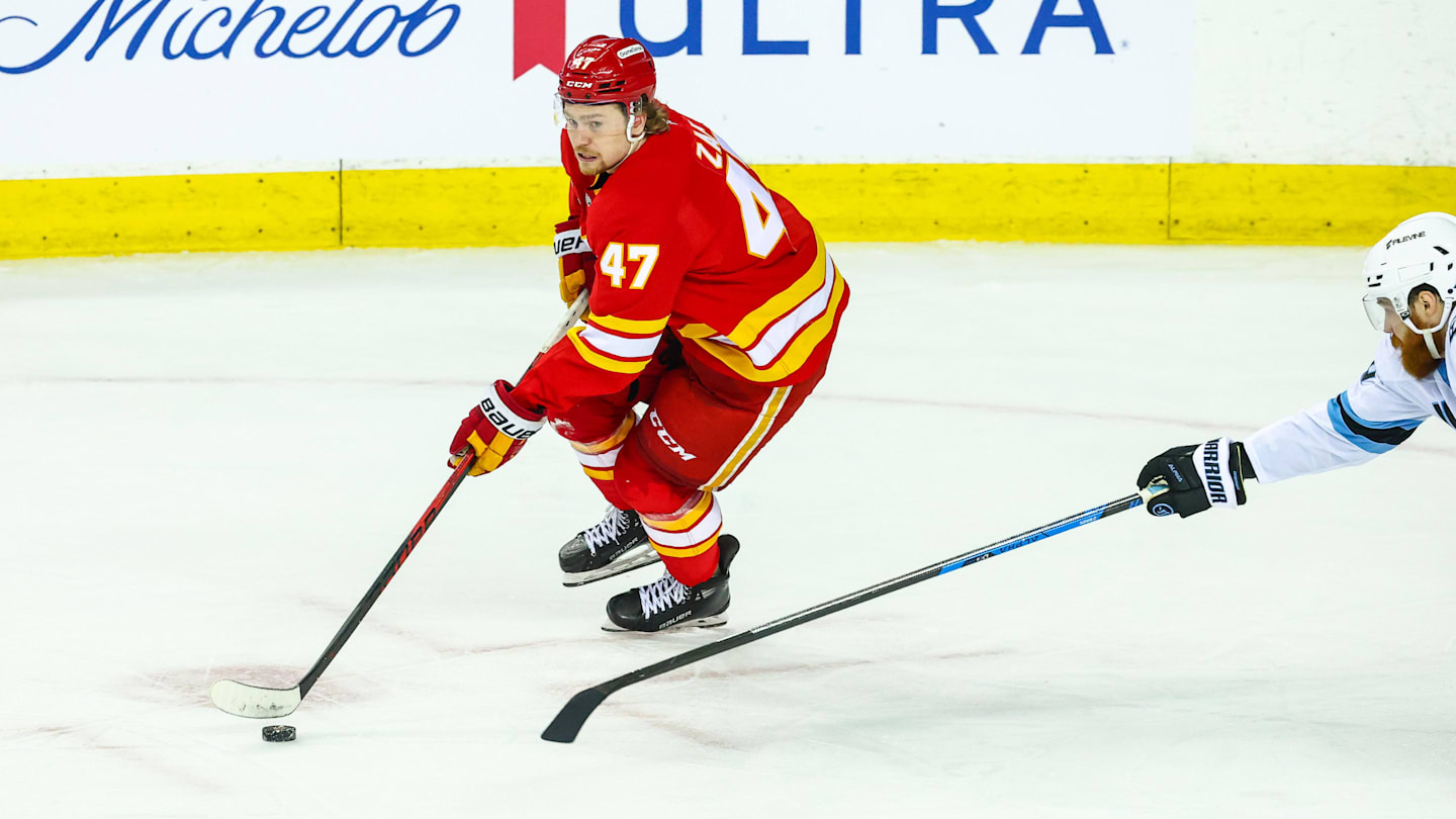 Apr 12, 2026; Calgary, Alberta, CAN; Calgary Flames center Connor Zary (47) controls the puck against the Utah Mammoth during the third period at Scotiabank Saddledome. Mandatory Credit: Sergei Belski-Imagn Images
