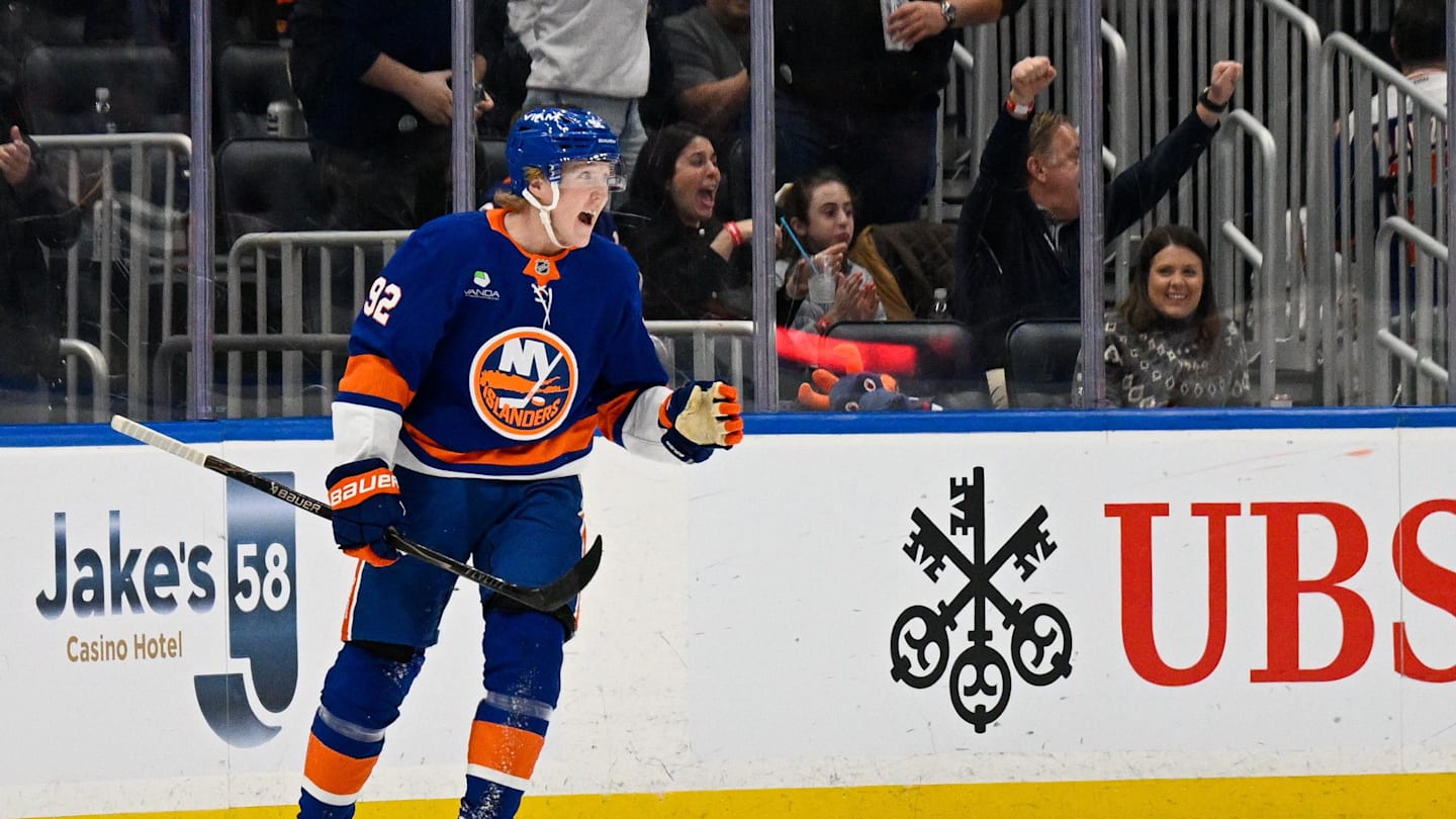 Mar 14, 2026; Elmont, New York, USA;  New York Islanders right wing Simon Holmstrom (92) celebrates his second goal against the Calgary Flames during the first period at UBS Arena. Mandatory Credit: Dennis Schneidler-Imagn Images