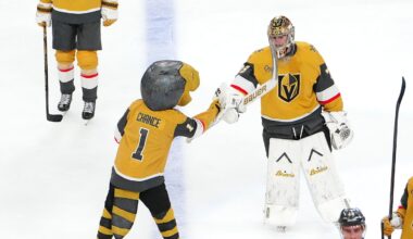 Apr 15, 2026; Las Vegas, Nevada, USA; Vegas Golden Knights goaltender Carter Hart (79) celebrates with Golden Knights mascot Chance after defeating the Seattle Kraken 4-1 at T-Mobile Arena. Mandatory Credit: Stephen R. Sylvanie-Imagn Images