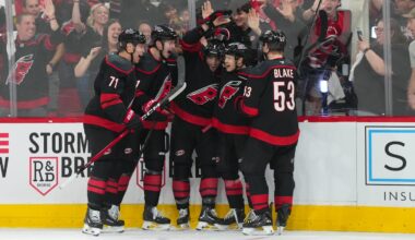 Apr 18, 2026; Raleigh, North Carolina, USA; Carolina Hurricanes left wing Taylor Hall (71) is congratulated by defenseman Alexander Nikishin (21)  defenseman Shayne Gostisbehere (4) center Logan Stankoven (22) and right wing Jackson Blake (53) after his goal against the Ottawa Senators during the third period in game one of the first round of the 2026 Stanley Cup Playoffs at Lenovo Center. Mandatory Credit: James Guillory-Imagn Images