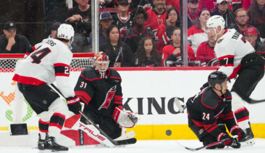 Apr 18, 2026; Raleigh, North Carolina, USA; Carolina Hurricanes center Seth Jarvis (24) with goaltender Frederik Andersen (31) go to block the shot by Ottawa Senators left wing Brady Tkachuk (7) during the third period in game one of the first round of the 2026 Stanley Cup Playoffs at Lenovo Center. Mandatory Credit: James Guillory-Imagn Images