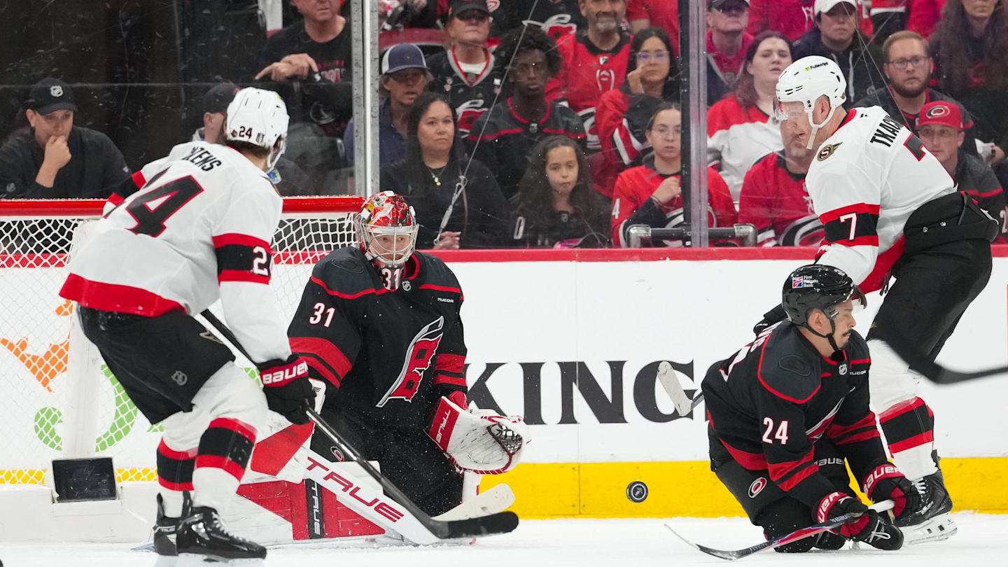 Apr 18, 2026; Raleigh, North Carolina, USA; Carolina Hurricanes center Seth Jarvis (24) with goaltender Frederik Andersen (31) go to block the shot by Ottawa Senators left wing Brady Tkachuk (7) during the third period in game one of the first round of the 2026 Stanley Cup Playoffs at Lenovo Center. Mandatory Credit: James Guillory-Imagn Images