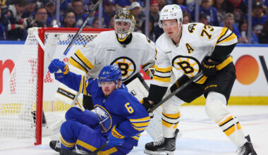Apr 19, 2026; Buffalo, New York, USA; Boston Bruins defenseman Charlie McAvoy (73) knocks down Buffalo Sabres left wing Zach Benson (6) in front of the net as Boston Bruins goaltender Jeremy Swayman (1) watches the puck during the second period in game one of the first round of the 2026 Stanley Cup Playoffs at KeyBank Center. Mandatory Credit: Timothy T. Ludwig-Imagn Images