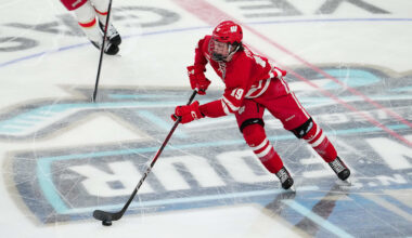 Apr 11, 2026; Las Vegas, Nevada, United States; Wisconsin Badgers forward Quinn Finley (19) skates with the puck during the second period against the Denver Pioneers in the championship game of the NCAA men's ice hockey Frozen Four at T-Mobile Arena. Mandatory Credit: Stephen R. Sylvanie-Imagn Images