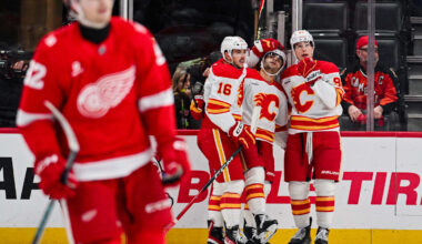 Mar 16, 2026; Detroit, Michigan, USA; Calgary Flames right wing Matt Coronato (27) celebrates his goal with teammates during the second period at Little Caesars Arena. Mandatory Credit: Tim Fuller-Imagn Images