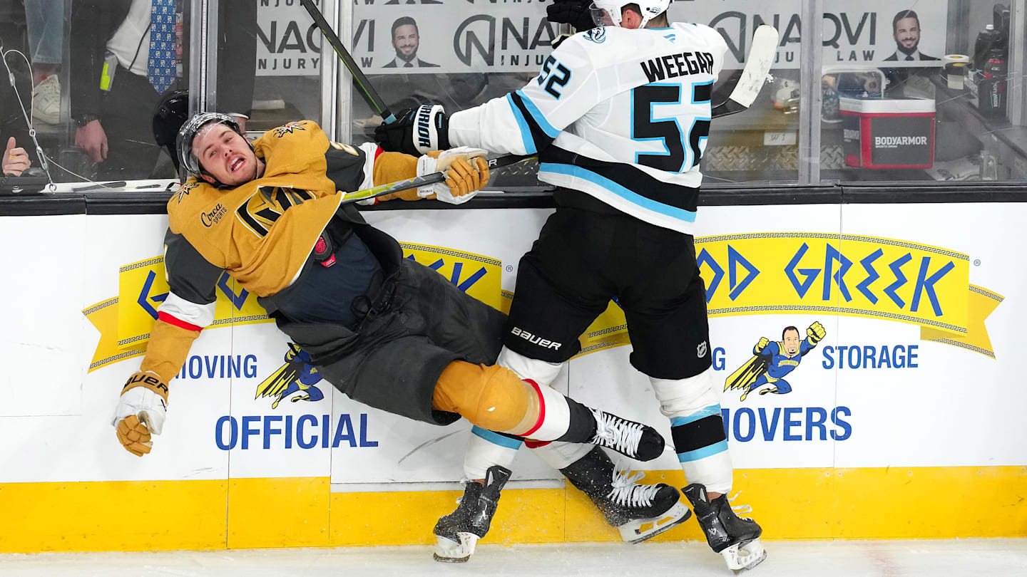 Apr 21, 2026; Las Vegas, Nevada, USA; Utah Mammoth defenseman MacKenzie Weegar (52) checks Vegas Golden Knights center Brett Howden (21) during the third period of game two of the first round of the 2026 Stanley Cup Playoffs at T-Mobile Arena. Mandatory Credit: Stephen R. Sylvanie-Imagn Images