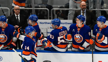 San Jose Sharks center Macklin Celebrini defends against New York Islanders left wing Ondrej Palat.