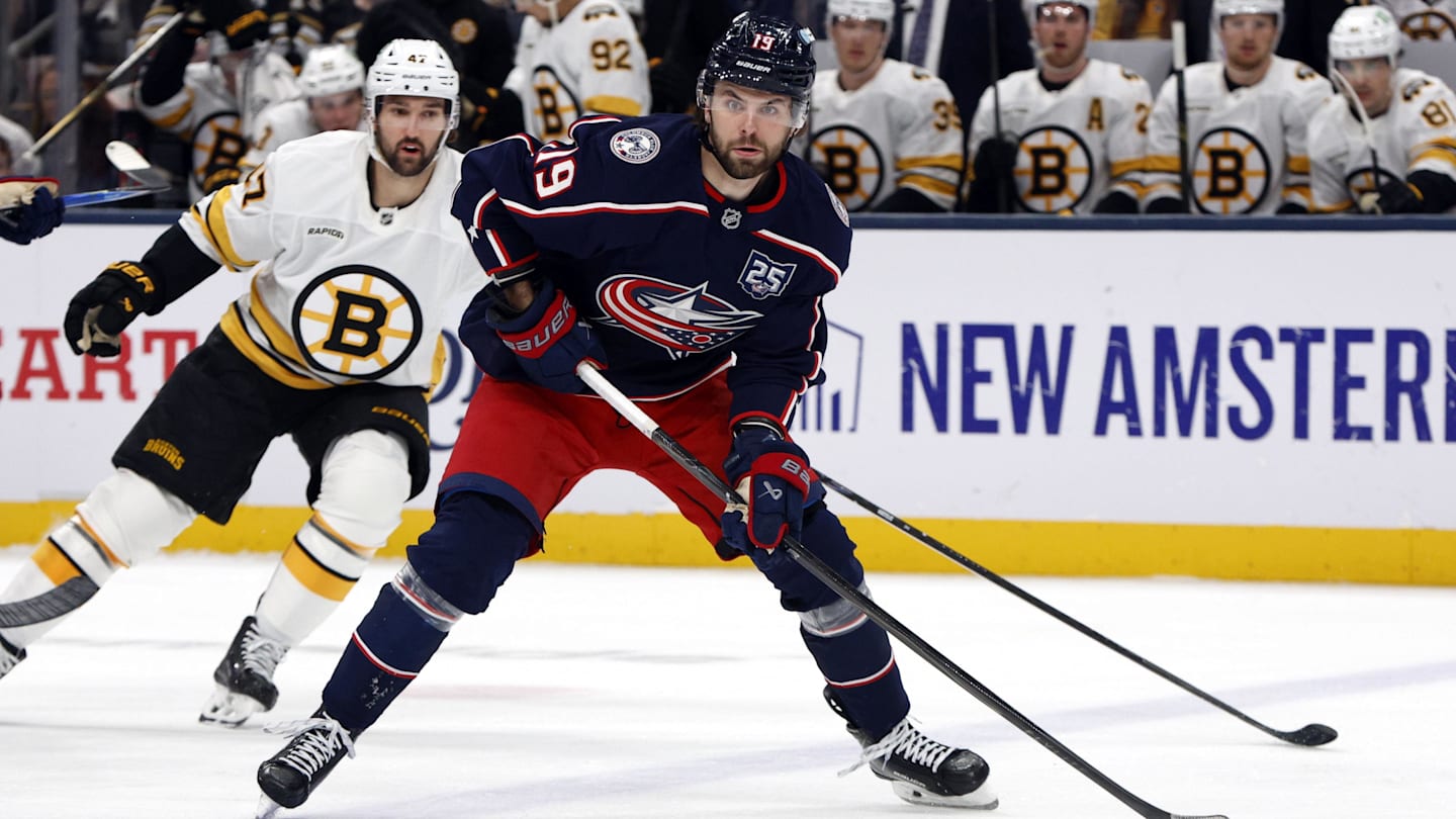 Apr 12, 2026; Columbus, Ohio, USA; Columbus Blue Jackets center Adam Fantilli (19) looks to pass as Boston Bruins center Mark Kastelic (47) trails the play during the first period at Nationwide Arena. Mandatory Credit: Russell LaBounty-Imagn Images