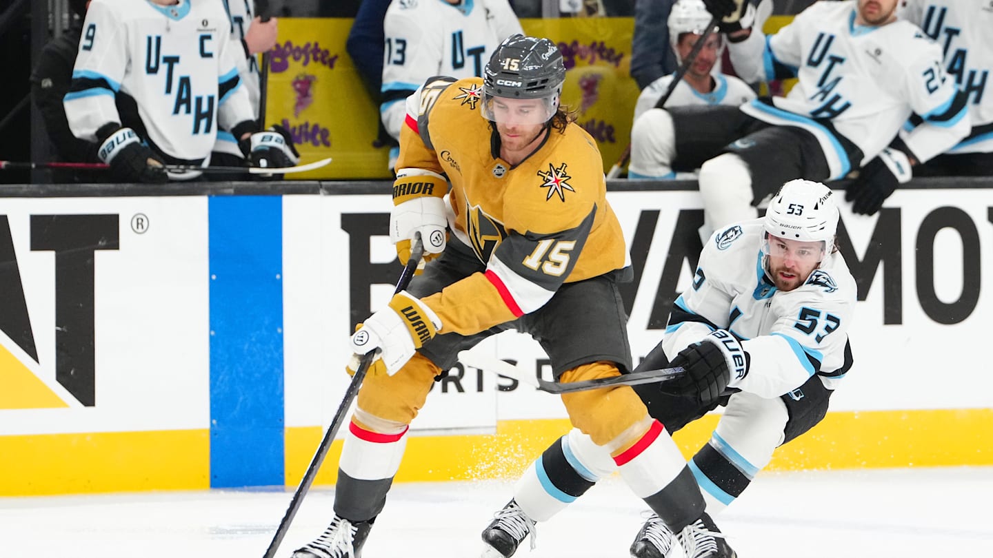 Apr 19, 2026; Las Vegas, Nevada, USA; Vegas Golden Knights defenseman Noah Hanifin (15) skates the puck away from Utah Mammoth left wing Michael Carcone (53) during the second period of game one of the first round of the 2026 Stanley Cup Playoffs at T-Mobile Arena. Mandatory Credit: Stephen R. Sylvanie-Imagn Images