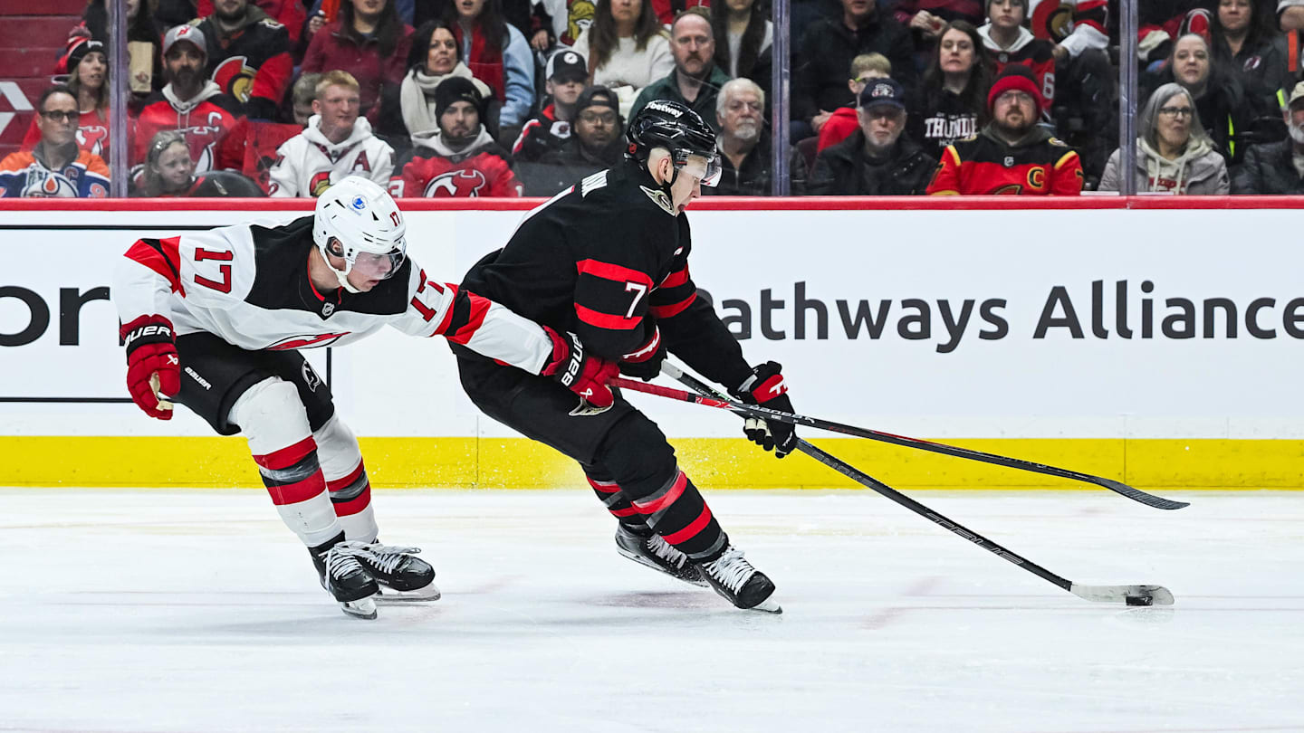 Jan 31, 2026; Ottawa, Ontario, CAN; Ottawa Senators left wing Brady Tkachuk  (7) plays the puck against New Jersey Devils defenseman Simon Nemec  (17) during the third period at Canadian Tire Centre. Mandatory Credit: David Kirouac-Imagn Images