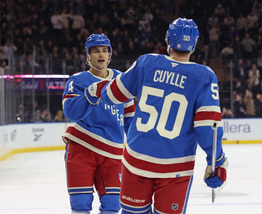 New York Rangers left wing Will Cuylle (50) is greeted by New York Rangers defenseman Braden Schneider (4) after he scores a goal