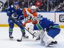 Canucks goalie Kevin Lankinen makes a stop against Anaheim's Ryan Poehling earlier this week in Vancouver.