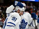 Toronto Maple Leafs centre John Tavares (91) is greeted by teammates after scoring the game-winning goal during overtime of an NHL game against the Anaheim Ducks on March 30, 2026, in Anaheim, Calif. 