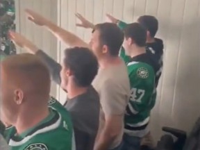 Fans at an NHL game between the Dallas Stars and Toronto Maple Leafs perform a Nazi salute.