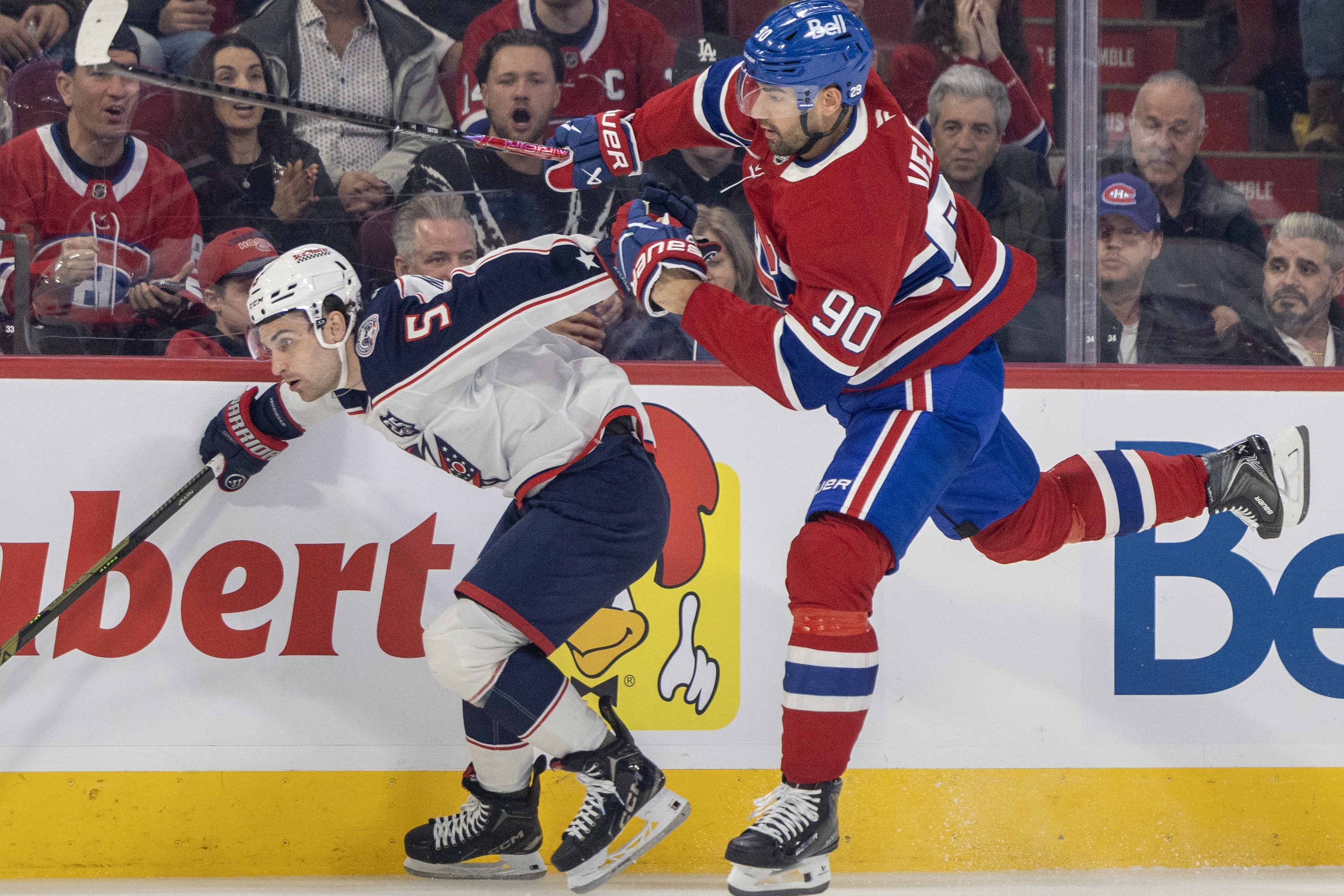 Canadiens forward Joe Veleno hops past Columbus Blue Jackets' Denton Mateychuk during third period in Montreal on March 26.