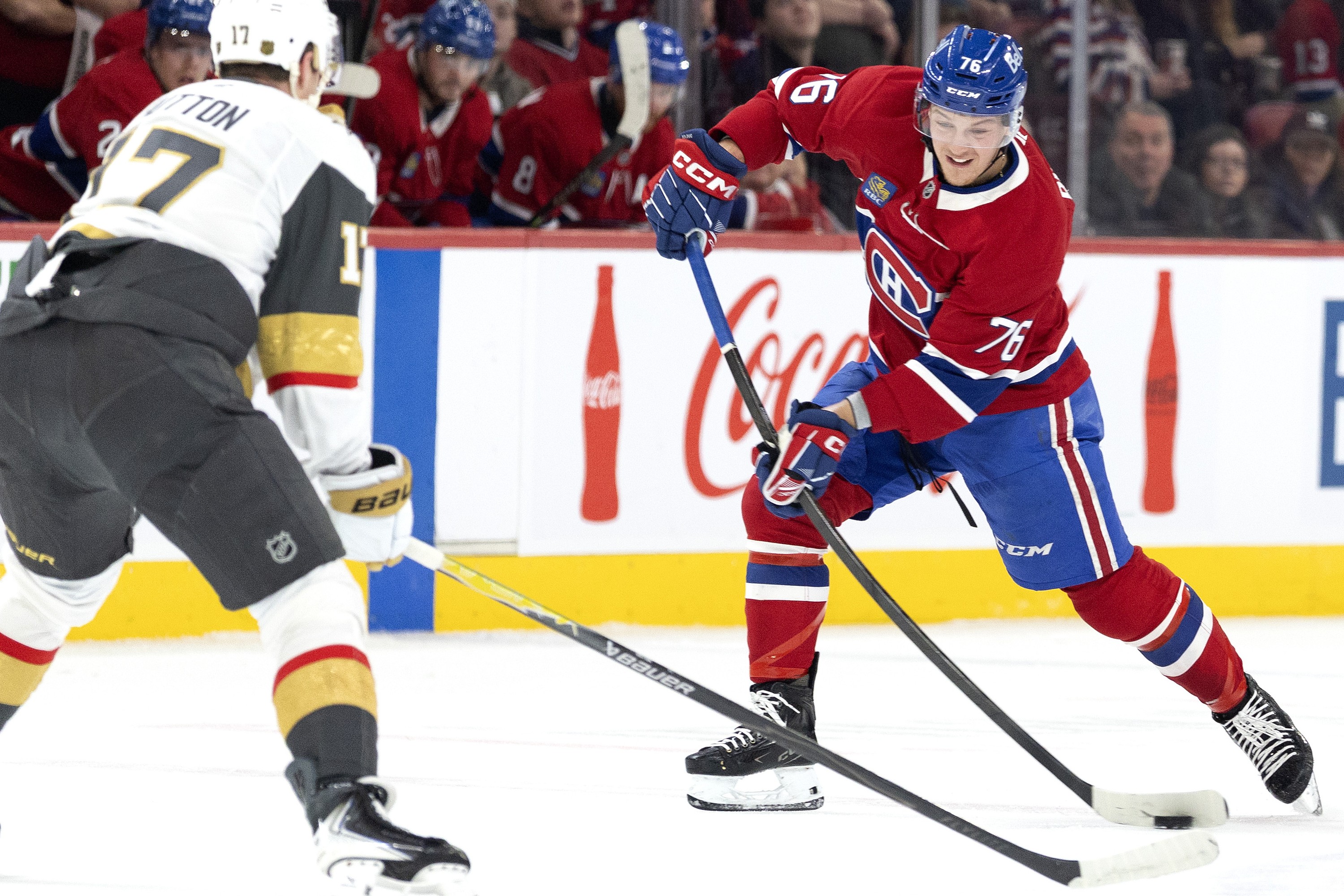 Canadiens winger Zachary Bolduc dumps the puck over the blue line as Vegas Golden Knights' Ben Hutton defends in Montreal on Jan. 27.