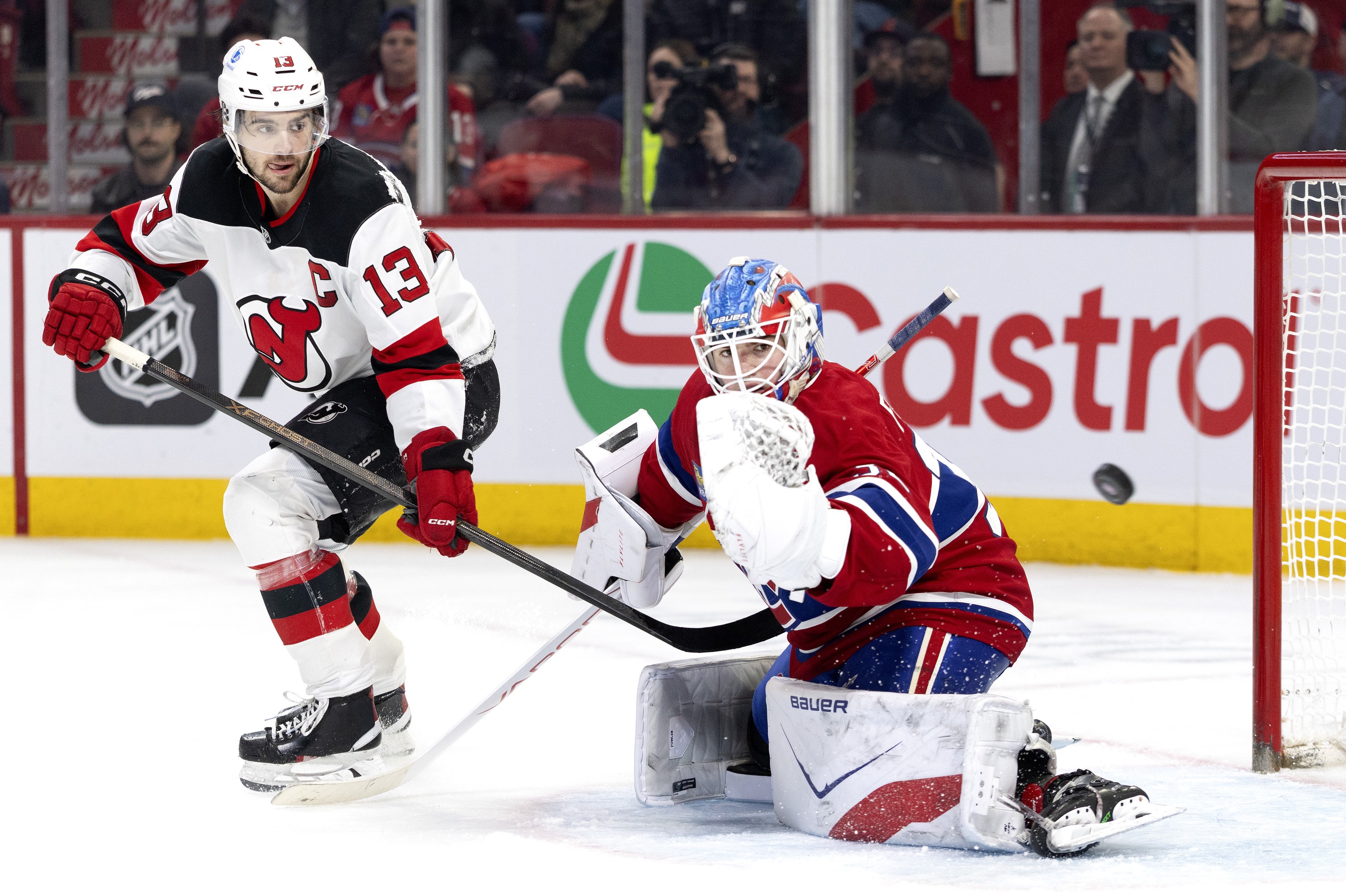 New Jersey Devils centre Nico Hischier watches a shot go wide against Montreal Canadiens goaltender Jacob Fowler.