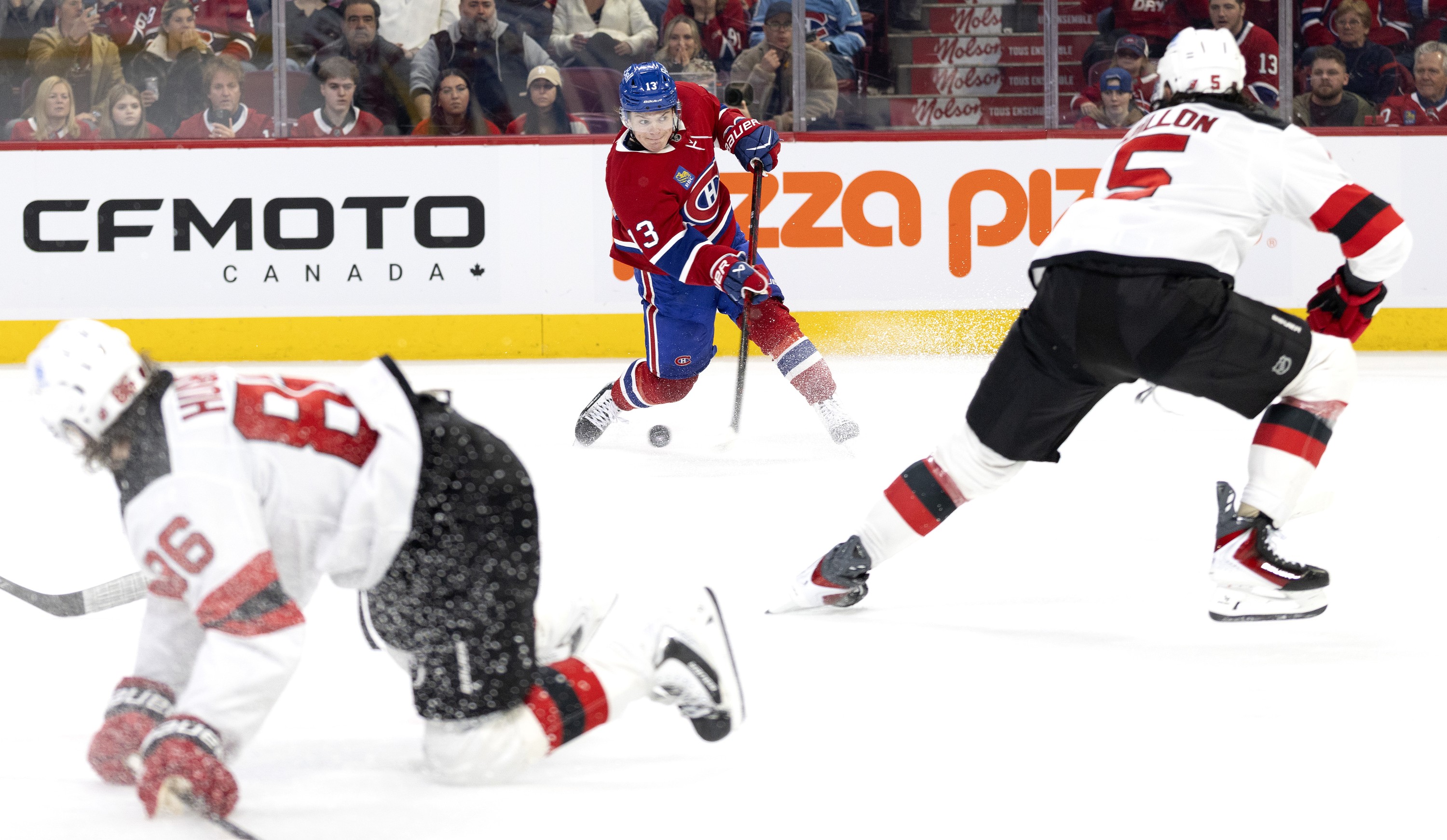 Montreal Canadiens right wing Cole Caufield takes a shot against the New Jersey Devils.