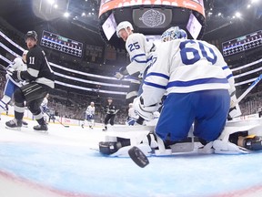 Toronto Maple Leafs goaltender Joseph Woll, right, is scored on during Saturday's game against the Los Angeles Kings.