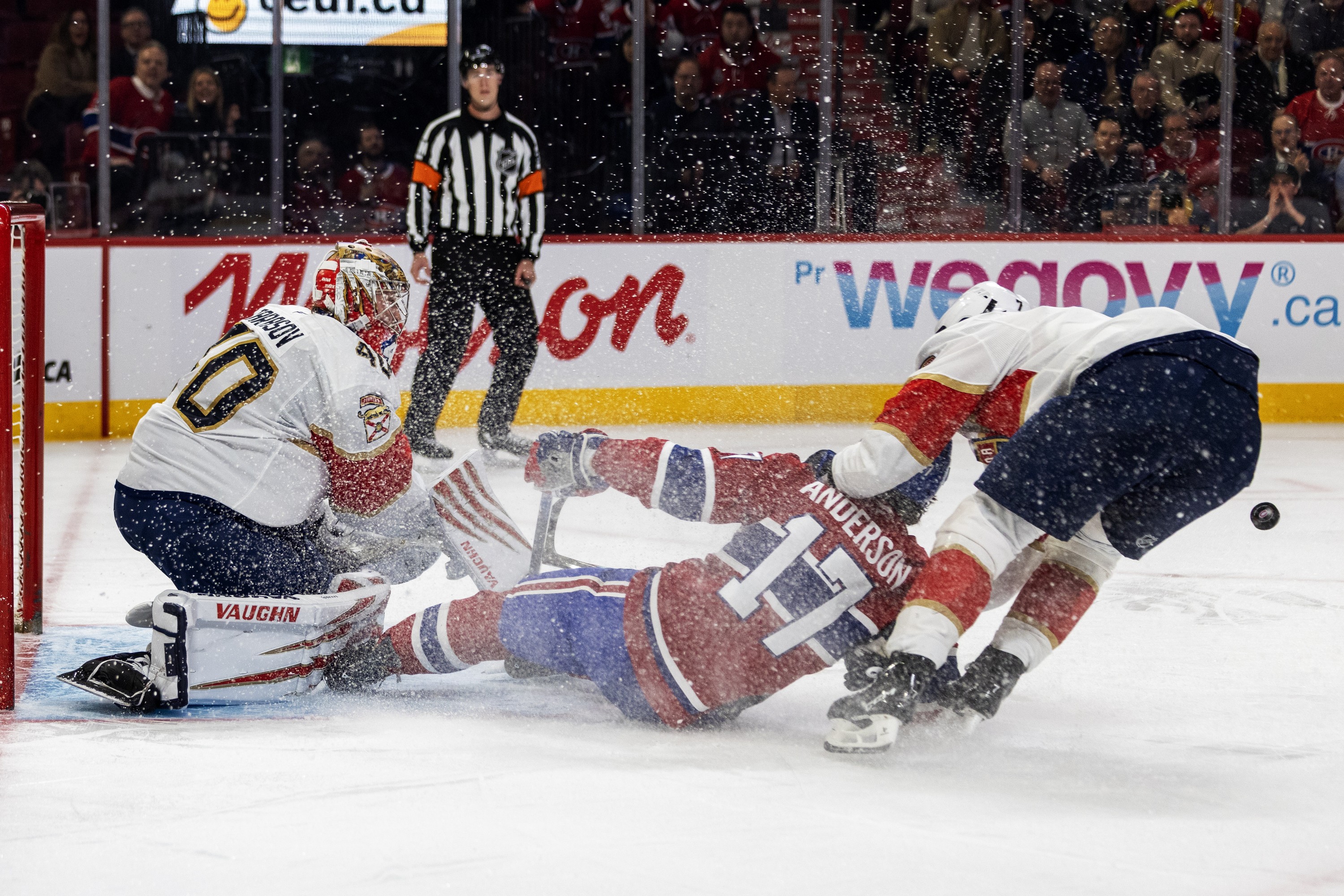 "I think it's going to be good for us to play a team like Tampa that has a lot of firepower and plays physical, too," says Canadiens winger Josh Anderson, getting dragged down by Florida Panthers' Dmitry Kulikov for a penalty in front of goalie Daniil Tarasov during third period in Montreal on Tuesday.
