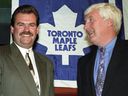 Toronto Maple Leafs new head coach Pat Burns (left) is greeted at a news conference by General Manager Cliff Fletcher in 1992.