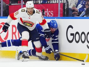 Florida Panthers' A.J. Greer checks Toronto Maple Leafs' Auston Matthews during a game earlier this season.