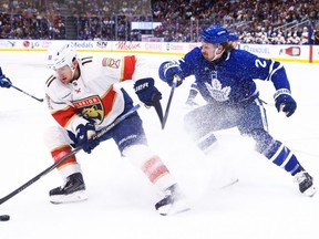 Florida Panthers forward Mackie Samoskevich protects the puck