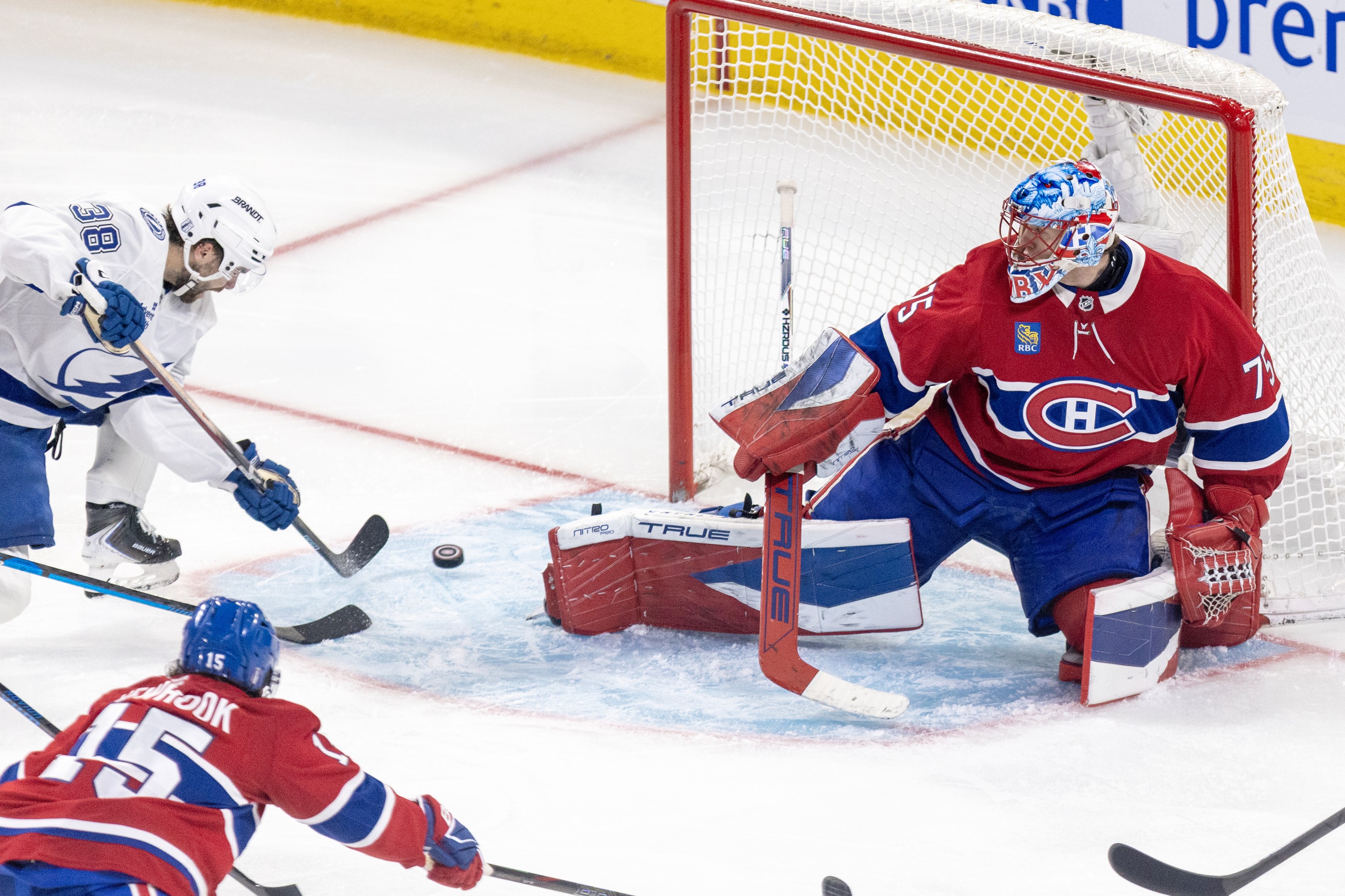 Tampa Bay Lightning's Brandon Hagel scores on Montreal Canadiens goalie Jakub Dobes.