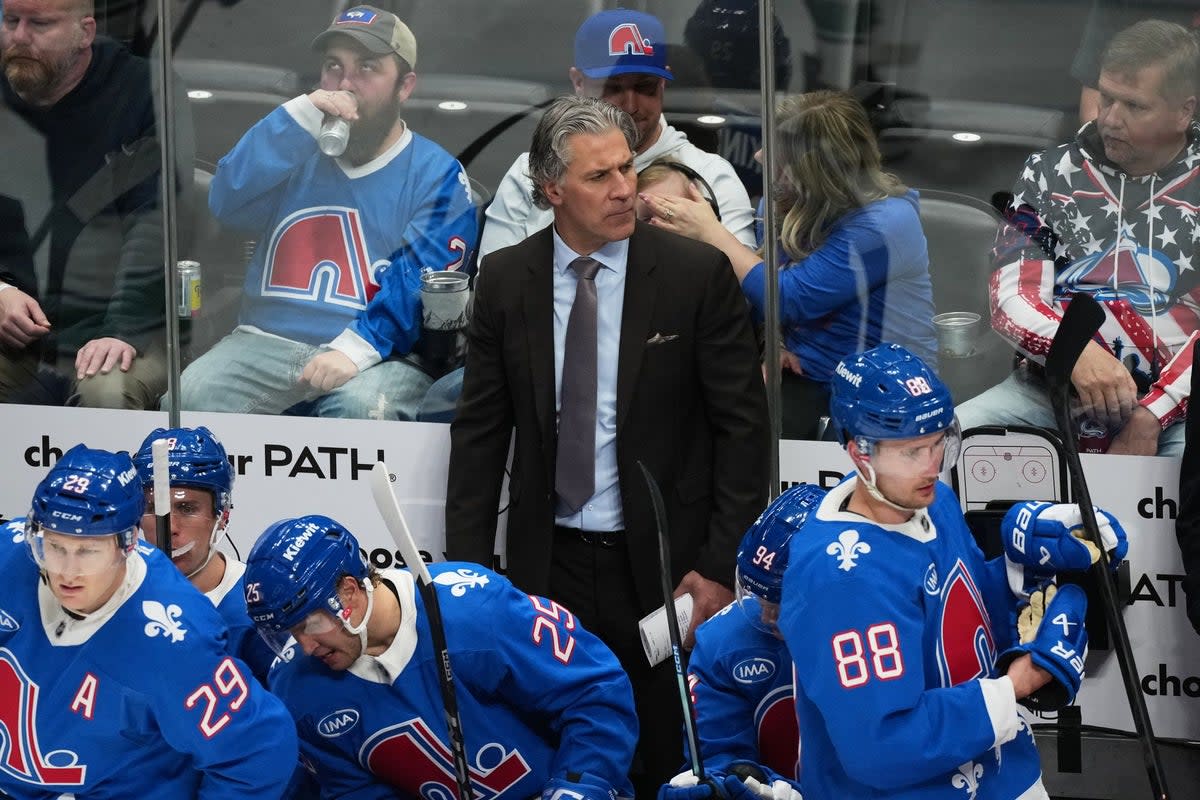 Jared Bednar, head coach of the Colorado Avalanche ice hockey team, was taken to hospital after being struck in the side of the head by a rogue puck (AP)