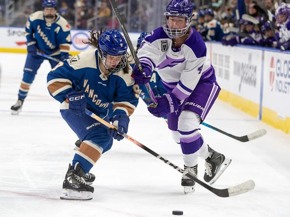  Minnesota Frost defenceman Kendall Cooper battles with Vancouver Goldeneyes forward Katie Chan during the third period of the PWHL Takeover Tour at Rogers Place in Edmonton on Saturday Dec. 27, 2025.
