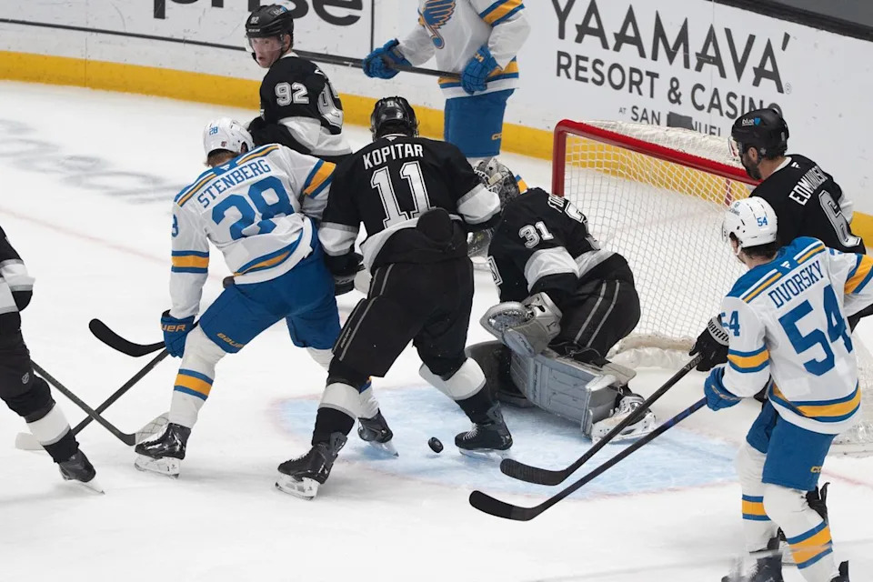 Los Angeles Kings Goalie Anton Forsberg (31) saves the puck from going into the goal while in the crowd during an NHL match against the St. Louis Blues on April 1st, 2026 in Los Angeles, California.