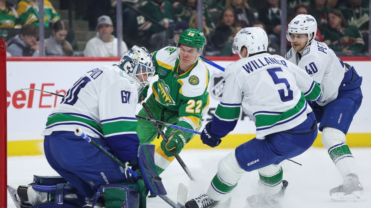 Wild wrap up a playoff spot with 5-2 victory over the Canucks