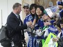 In 2011 Vancouver Canucks' general manager Mike Gillis arrives at Vancouver International Airport for the flight to Boston after taking a 3-2 series lead  against the Bruins in the Stanley Cup final.