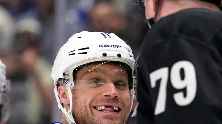 Toronto Maple Leafs center Max Domi, left, smiles as Los...