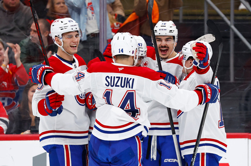 The Montr&eacute;al Canadiens players celebrate after a goal by defenseman Jayden Struble (47) during the first period of an NHL hockey game against the New Jersey Devils, Saturday, April 4, 2026, in Newark, N.J. (AP Photo/Noah K. Murray)