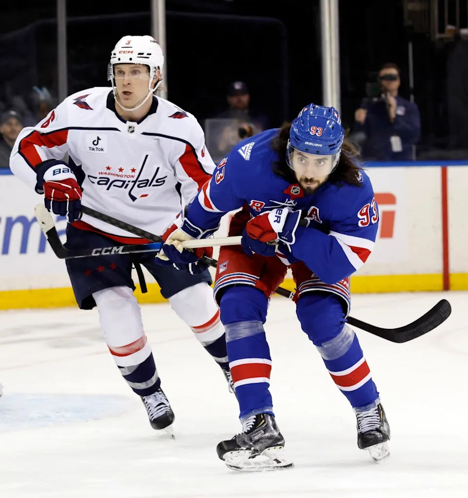 Mika Zibanejad and Washington Capitals defenseman Jakob Chychrun skate for the puck in the first period at Madison Square Garden in New York, USA, Sunday, April 05, 2026. JASON SZENES FOR THE NEW YORK POST