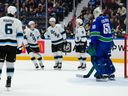 Dylan Guenther (#11) of the Utah Mammoth is congratulated after scoring a goal on Nikita Tolopilo of the Vancouver Canucks during the second period of their NHL game at Rogers Arena on April 4, 2026.