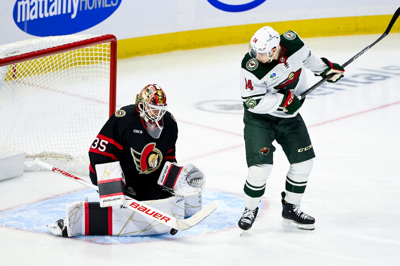 An Ottawa Sentators goalie blocking a shot