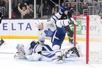 Toronto Maple Leafs defenceman Troy Stecher, right, trips over goaltender Joseph Woll during the second period against the Los Angeles Kings, Saturday, April 4, 2026, in Los Angeles. 