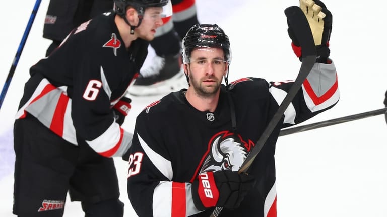 Buffalo Sabres defenseman Mattias Samuelsson (23) celebrates victory following the...