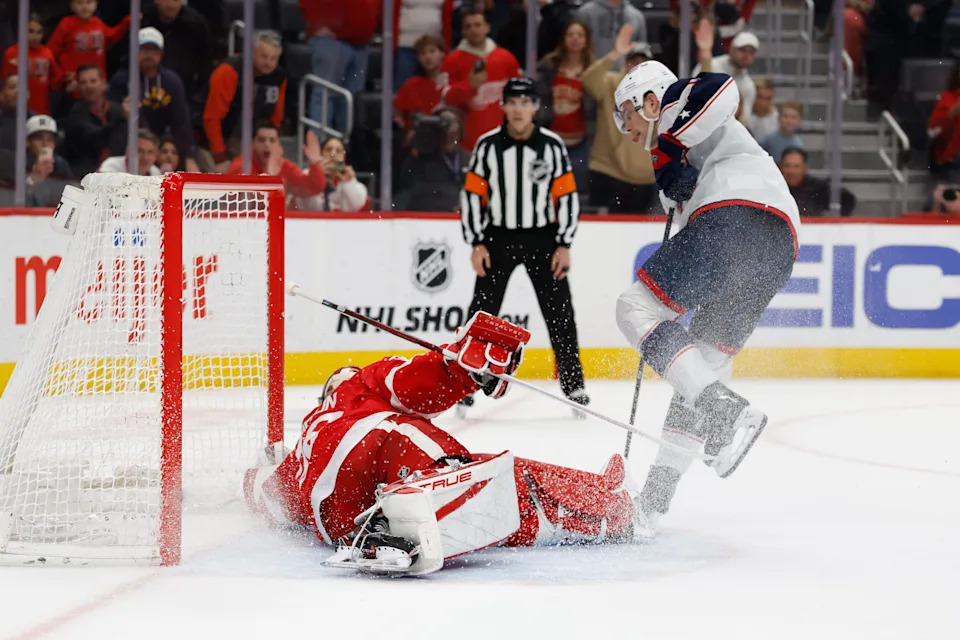 Columbus Blue Jackets center Charlie Coyle scores on Detroit Red Wings goaltender John Gibson to tie the score in the shootout at Little Caesars Arena, April 7, 2026. The Wings lost the game, 4-3.