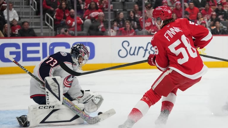 Columbus Blue Jackets goaltender Jet Greaves (73) stops a Detroit...