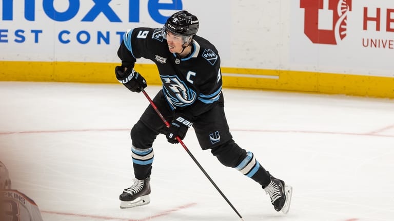 Utah Mammoth center Clayton Keller (9) shoots the puck to...