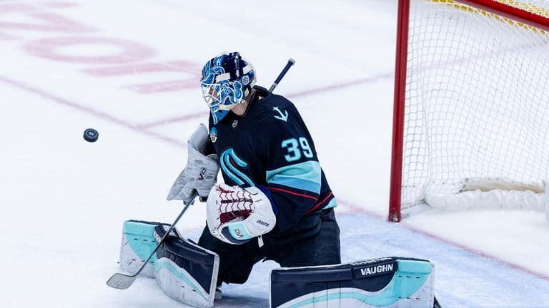 Seattle Kraken goaltender Nikke Kokko makes a save during the...