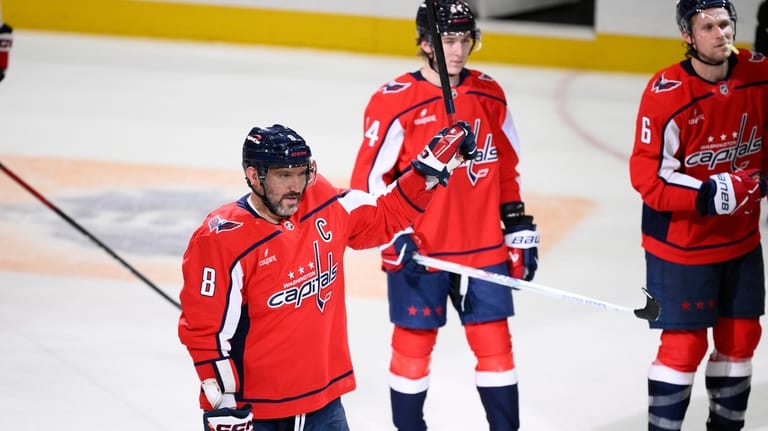 Washington Capitals left wing Alex Ovechkin (8) salutes the fans...