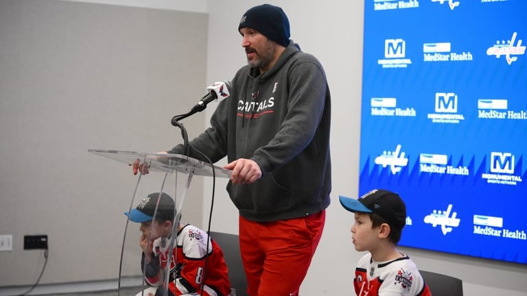 Washington Capitals left wing Alex Ovechkin, center, speaks at a...