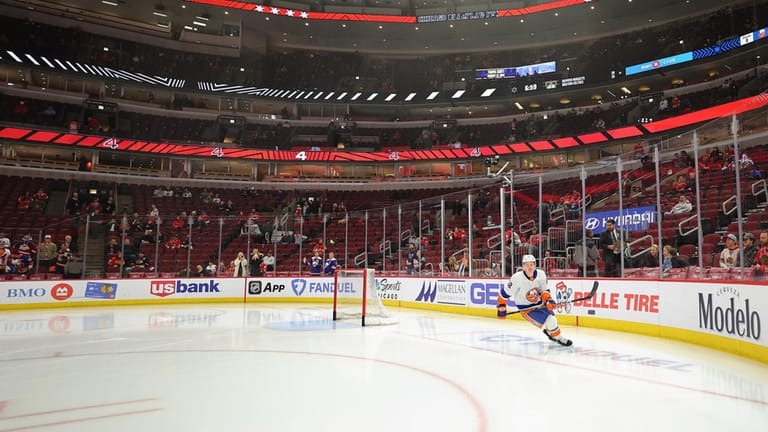The Islanders' Kyle MacLean skates his rookie lap at the...