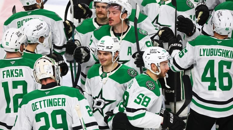 Dallas Stars teammates celebrate victory following a shootout of an...