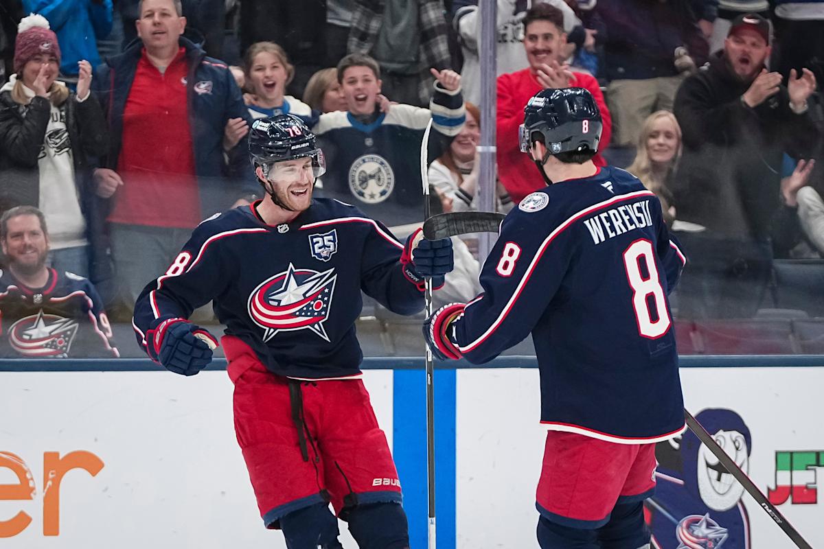 Columbus Blue Jackets defenseman Zach Werenski (8) celebrates a goal by defenseman Damon Severson (78) during the first period of the NHL hockey game against the Seattle Kraken at Nationwide Arena on March 21, 2026.